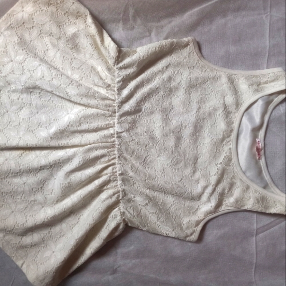Super adorable cream color peplum top